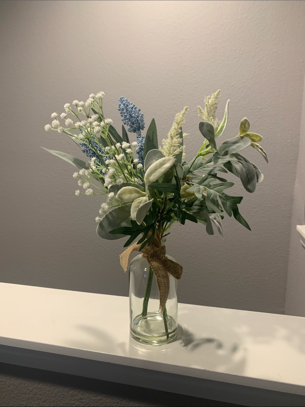Kirklands Blue and Green Faux Floral Bouquet in Clear Glass Jar